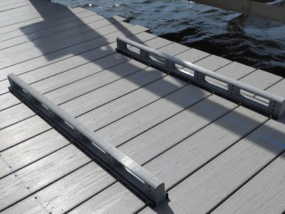 Wide shot of a deck installation using multiple Deck Board Spacers to evenly space and align several deck boards at once