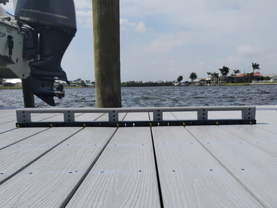Side-by-side comparison of deck boards spaced manually and using the Deck Board Spacer, showing consistent gaps and cleaner layout